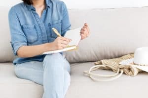 Woman planning out her Facebook group activities