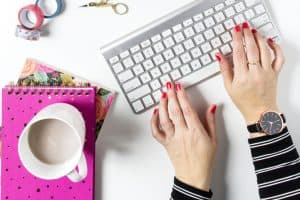 Woman sending an email to her list
