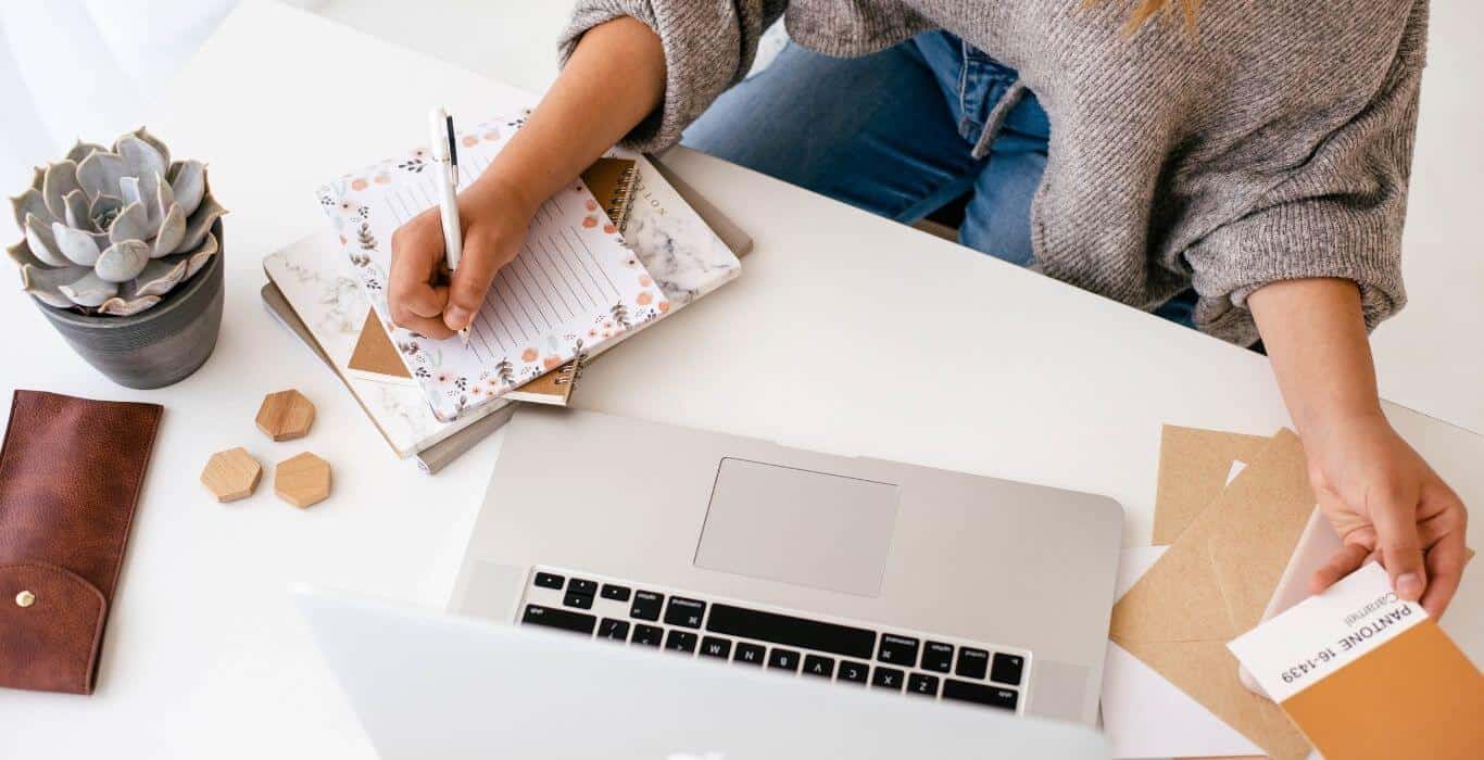 Web designer writing notes on how to make a business website more accessible